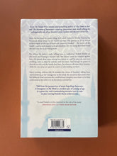 Load image into Gallery viewer, A Strangeness in My Mind by Orhan Pamuk: photo of the back cover which shows very minor scuff marks on the top-left corner.
