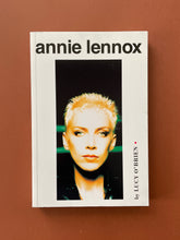 Load image into Gallery viewer, Annie Lennox by Lucy O&#39;Brien: photo of the front cover which shows very minor scuff marks along the edges.
