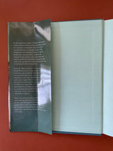 Load image into Gallery viewer, Australians by Thomas Keneally: photo of the inside of the front cover which shows a crease running down the flap of the dust jacket. No other creases anywhere else in the book.
