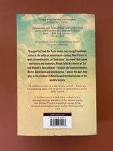 Load image into Gallery viewer, Barkskins by Annie Proulx: photo of the back cover which shows very minor scuff marks along the edges, and very minor creasing on the bottom-left corner.
