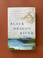 Load image into Gallery viewer, Black Dragon River by Dominic Ziegler: photo of the front cover which shows very minor scuff marks along the edges of the dust jacket.
