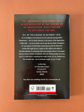 Load image into Gallery viewer, Black Klansman by Ron Stallworth: photo of the back cover which shows minor creasing on the bottom-left corner.
