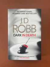 Load image into Gallery viewer, Dark in Death by J. D. Robb: photo of the front cover which shows very minor scuff marks along the edges, and minor creasing on the bottom-right corner.
