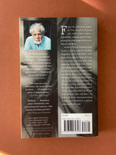 Load image into Gallery viewer, Divisadero by Michael Ondaatje: photo of the back cover which shows very minor scuff marks along the edges.
