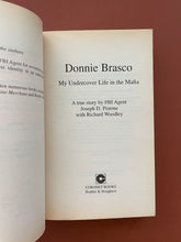 Load image into Gallery viewer, Donnie Brasco by Joseph D. Pistone: photo of the title page which shows very minor discolouring around the edges. All pages of the book have very minor discolouring around the edges, the worst of which is on this page.

