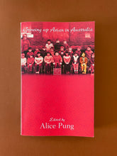 Load image into Gallery viewer, Growing Up Asian in Australia by Alice Pung: photo of the front cover which shows very minor scuff marks and creasing along the edges.
