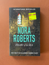 Load image into Gallery viewer, Heart of the Sea by Nora Roberts: photo of the front cover which shows very minor scuff marks along the edges.
