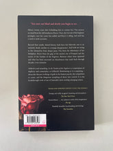 Load image into Gallery viewer, In the Garden of the Fugitives by Ceridwen Dovey: photo of the back cover which shows very minor scuff marks along the edges.
