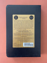 Load image into Gallery viewer, Lamb by Christopher Moore: photo of the back cover which shows minor wrinkling on the sticker.
