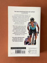 Load image into Gallery viewer, Lance Armstrong-Tour De Force by Daniel Coyle: photo of the back cover which shows very minor scuff marks along the edges.
