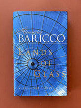 Load image into Gallery viewer, Lands of Glass by Alessandro Baricco: photo of the front cover which shows very minor (barely visible) scuff marks along the edges of the dust jacket.
