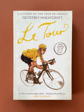 Load image into Gallery viewer, Le Tour-A History of the Tour de France by Geoffrey Wheatcroft: photo of the front cover which shows very minor (barely visible) scuff marks along the edges.
