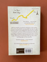 Load image into Gallery viewer, Le Tour-A History of the Tour de France by Geoffrey Wheatcroft: photo of the back cover which shows very minor (barely visible) scuff marks along the edges.
