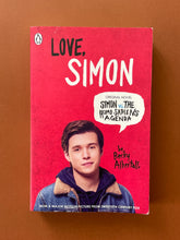 Load image into Gallery viewer, Love, Simon by Becky Albertalli: photo of the front cover which shows minor scuff marks along the edges, and some creasing on the top-left corner, under the Penguin logo.
