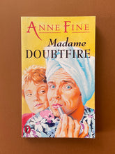 Load image into Gallery viewer, Madame Doubtfire by Anne Fine: photo of the front cover which shows very minor scuff marks along the edges, and creasing running down the left side of the cover, parallel to the spine. There are also some minor scratches.
