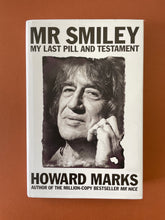 Load image into Gallery viewer, Mr Smiley by Howard Marks: photo of the front cover which shows very minor scuff marks along the edges of the dust jacket.
