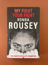 Load image into Gallery viewer, My Fight Your Fight by Ronda Rousey: photo of the front cover which shows very minor scuff marks along the edges, and creasing near the spine and on the top-right corner.
