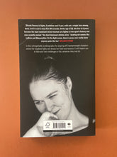 Load image into Gallery viewer, My Fight Your Fight by Ronda Rousey: photo of the back cover which shows obvious creasing on the top-left corner.
