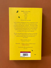 Load image into Gallery viewer, Olive by Emma Gannon: photo of the back cover which shows very minor (barely visible) scuff marks along the edges, and minor creasing running down the right side of the cover, parallel to the spine.
