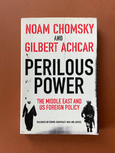 Load image into Gallery viewer, Perilous Power by Noam Chomsky, Gilbert Achcar: photo of the front cover which shows very minor scuff marks along the edges.
