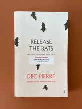 Load image into Gallery viewer, Release the Bats by DBC Pierre: photo of the front cover which shows very minor scuff marks and creasing.

