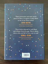 Load image into Gallery viewer, Roar by Cecelia Ahern book: photo of the back cover. There are very minor scuff marks along the edges of the dust jacket.
