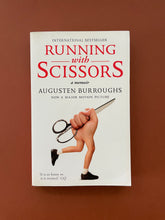 Load image into Gallery viewer, Running with Scissors by Augusten Burroughs: photo of the front cover which shows very minor scuff marks along the edges, and minor creasing on the bottom-right corner.
