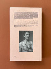 Load image into Gallery viewer, Russian Criminal Tattoo-Encyclopaedia Volume I: photo of the back cover which shows very minor scuff marks along the edges, and very minor soiling.
