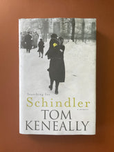 Load image into Gallery viewer, Searching for Schindler by Tom Keneally: photo of the front cover which shows minor scuff marks along the edges, and wrinkling along the top and bottom of the dust jacket.
