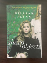 Load image into Gallery viewer, Sharp Objects by Gillian Flynn book: photo of front cover. There is  creasing visible that runs the length of the cover, parallel to the spine.
