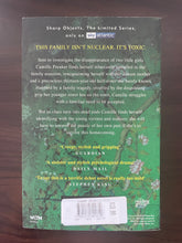 Load image into Gallery viewer, Sharp Objects by Gillian Flynn book: photo of the back cover. There is very fine and not very noticeable creasing running down the cover, along the right-hand side of the cover.
