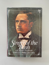 Load image into Gallery viewer, Singer of the Bush by Banjo Paterson: photo of the front cover which shows very minor scuff marks along the edges.
