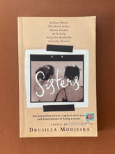 Load image into Gallery viewer, Sisters by Drusilla Modjeska: photo of the front cover which shows very minor scuff marks along the edges, and minor creasing on the top-right corner.
