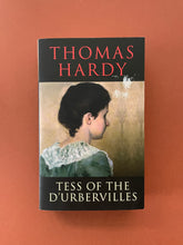 Load image into Gallery viewer, Tess of the D&#39;Urbervilles by Thomas Hardy: photo of the front cover which shows obvious scuff marks under the name of the author.
