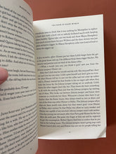 Load image into Gallery viewer, The Book of Night Women by Marlon James: photo of page 45 which shows a minor crease on the bottom-right corner of the page. Pages 45/46 are the only pages with any creasing throughout the book.
