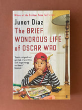 Load image into Gallery viewer, The Brief Wondrous Life of Oscar Wao by Junot Diaz: photo of the front cover which shows very minor (barely visible) scuff marks along the edges.
