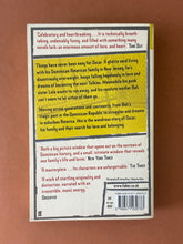 Load image into Gallery viewer, The Brief Wondrous Life of Oscar Wao by Junot Diaz: photo of the back cover which shows very minor (barely visible) scuff marks along the edges.

