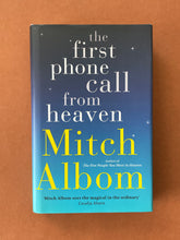 Load image into Gallery viewer, The First Phone Call From Heaven by Mitch Albom: photo of the front cover which shows very minor scuff marks along the edges of the dust jacket.
