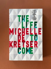 Load image into Gallery viewer, The Life to Come by Michelle de Kretser: photo of the front cover which shows creasing on the top-right corner.
