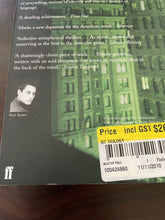 Load image into Gallery viewer, The New York Trilogy by Paul Auster book: photo of very minor scuff marks (barely visible) along the bottom-edge of the back cover.
