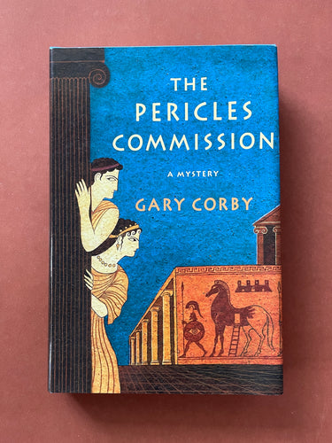 The Pericles Commission by Gary Corby: photo of the front cover which shows very minor (barely visible) scuff marks along the edges of the dust jacket.