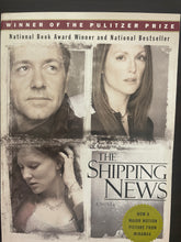 Load image into Gallery viewer, The Shipping News by Annie Proulx book: photo of a rectangular white patch of discolouring on the front cover, between the images of Kevin Spacey and Julianne Moore, probably made by the removal of a sticker.
