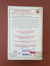 Load image into Gallery viewer, The Sympathizer by Viet Thanh Nguyen: photo of the back cover which shows very minor scuff marks along the edges.
