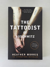 Load image into Gallery viewer, The Tattooist of Auschwitz by Heather Morris: photo of the front cover which shows very minor (barely visible) scuff marks along the edges.
