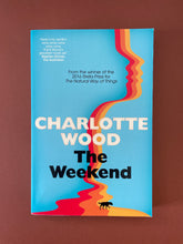 Load image into Gallery viewer, The Weekend by Charlotte Wood: photo of the front cover which shows very minor scuff marks along the edges, and very minor creasing to the bottom-left corner, near the spine.

