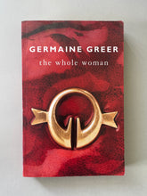 Load image into Gallery viewer, The Whole Woman by Germaine Greer: photo of the front cover which shows scuff marks, creasing and scratches.

