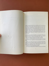 Load image into Gallery viewer, Untold Stories by Alan Bennett: photo of page xv which shows four very small punctures, and page 3. which has a a scratch above the text. 
