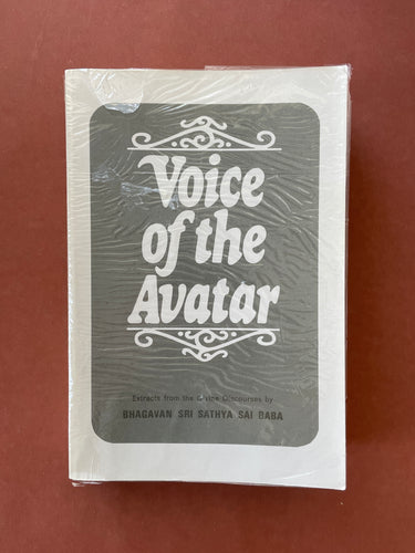 Voice of the Avatar by Bhagavan Sri Sathya Sai Baba: photo of the front cover which shows very minor scuff marks and creasing around the edges, and a flimsy plastic cover which has a hole in the front and significant creasing all over.