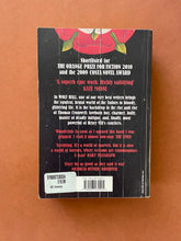 Load image into Gallery viewer, Wolf Hall by Hilary Mantel: photo of the back cover which shows creasing and scuff marks.
