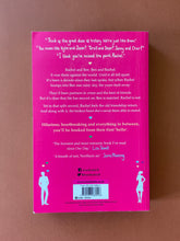 Load image into Gallery viewer, You Had Me at Hello by Mhairi McFarlane: photo f the back cover which shows very minor scuff marks along the edges, and  obvious creasing on the right side of the cover, parallel to the spine.
